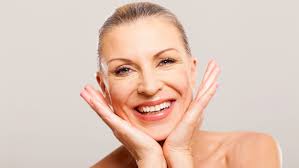 Image result for woman putting on cream 50+